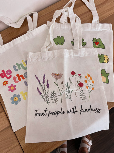 Treat people with kindness tote bag