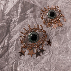 ojo star earrings